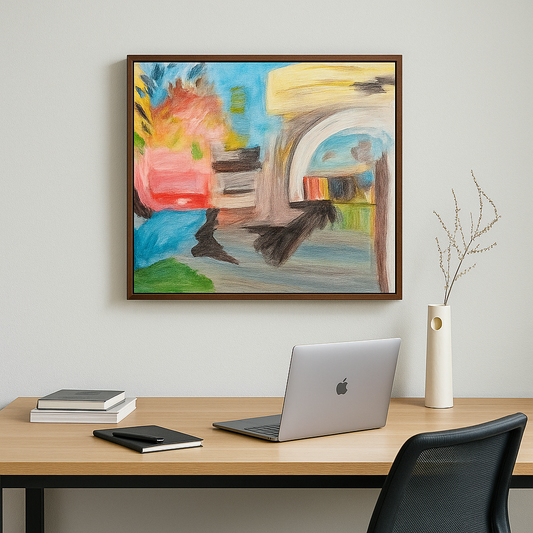 Colorful abstract painting on a wall above a desk with a laptop and books.